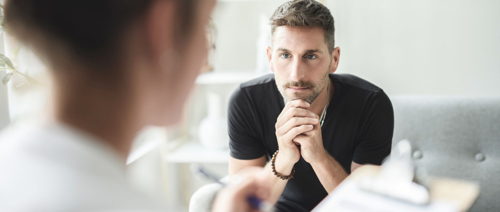 A man learning about outpatient mental health treatment programs at Safe Harbor Behavioral Health in Gloucester, MA.