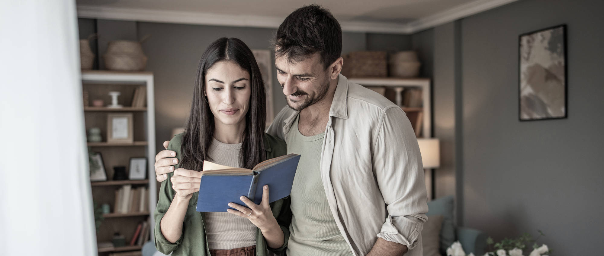 A couple reading the FAQs from Safe Harbor Behavioral Health, a mental health treatment center in Gloucester, MA.