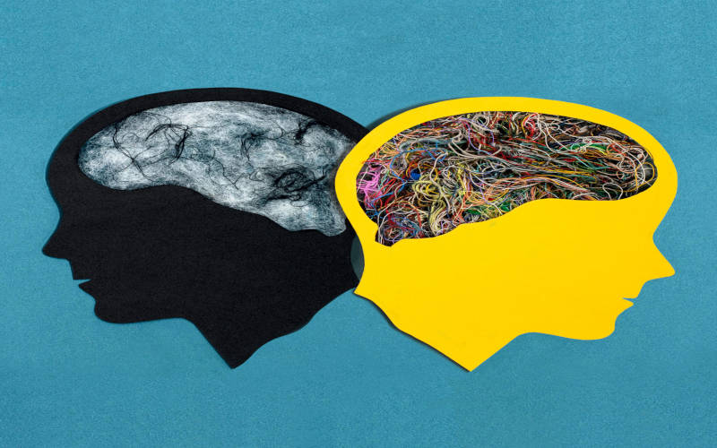 A picture of two drawn heads facing away from each other, the cover image for an article titled "Dual Diagnosis: Treating Mental Health and Substance Use Together."