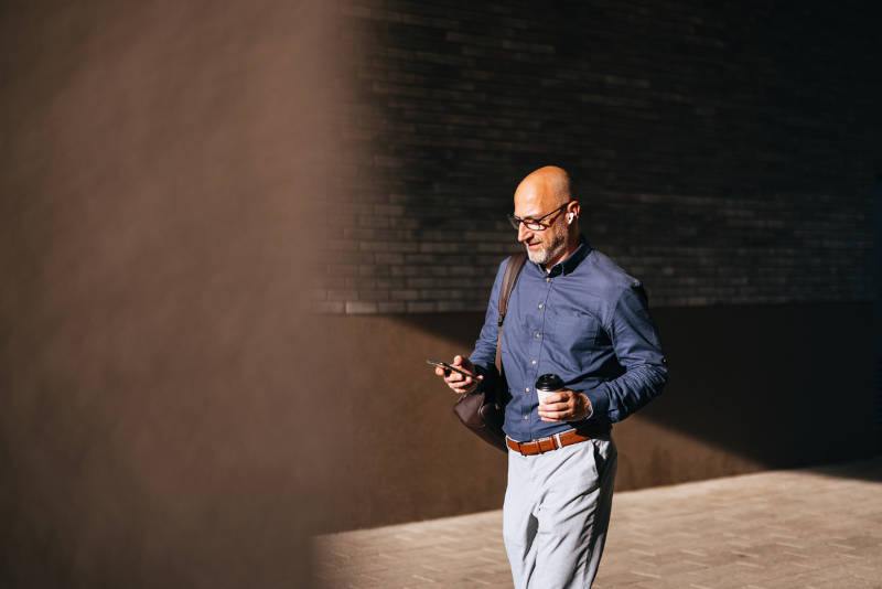 A middle-aged man showing positive signs of progress from his mental health treatment.